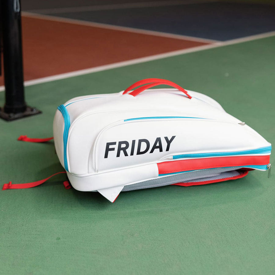 Three Friday USA Pickleball-approved paddles with colorful designs displayed on an orange background.